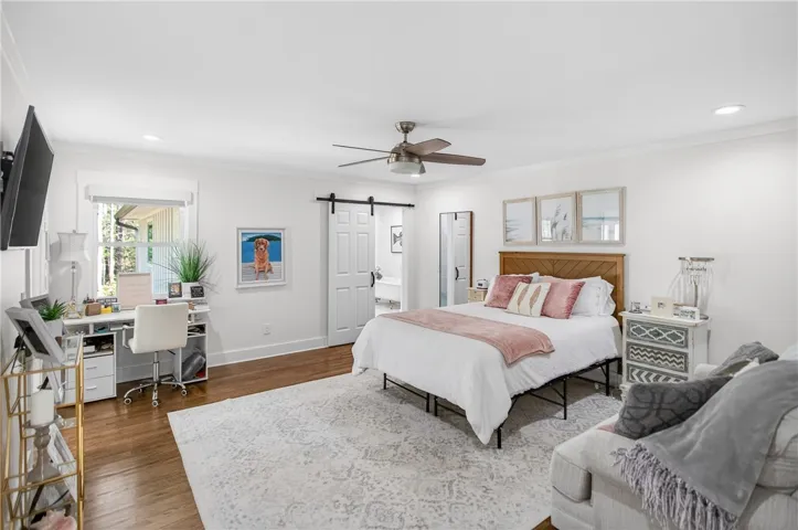 Hardwood floors and a spacious layout define this comfortable, light-filled sleeping sanctuary.