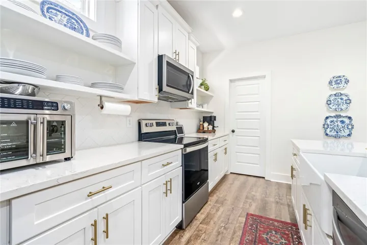 Floating shelves add character to this charming cottage style home