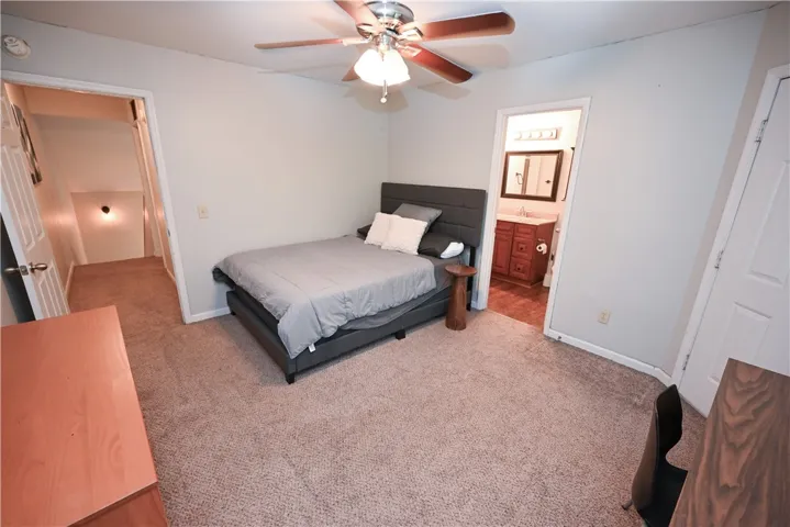 A well-proportioned bedroom with convenient bathroom access awaits.