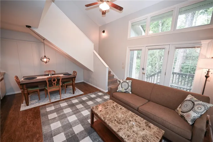 Lofty ceilings complement generous natural light, illuminating an open-concept living area perfect for entertaining.