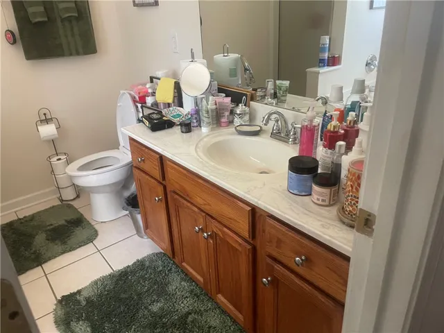 A classic bathroom vanity with a full mirror, offering a functional space for daily routines.