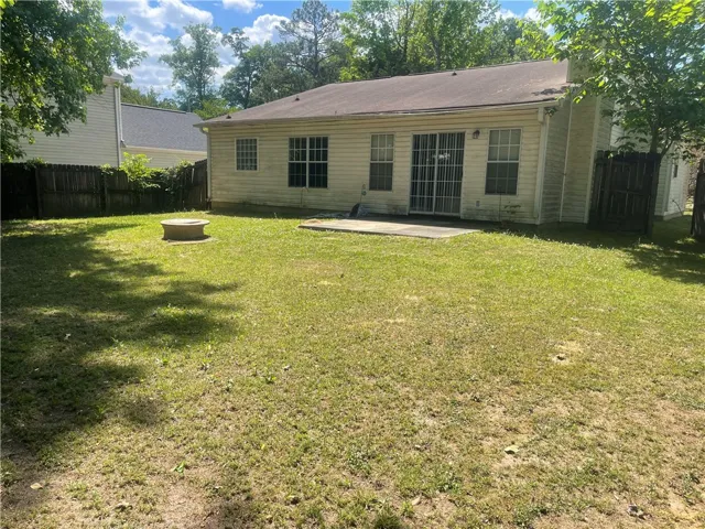 A spacious backyard awaits, complete with a fire pit for evening gatherings and a comfortable patio​​‌​​​​‌​​‌‌​‌‌​​​‌‌​‌​‌​‌​​​‌​​ area.