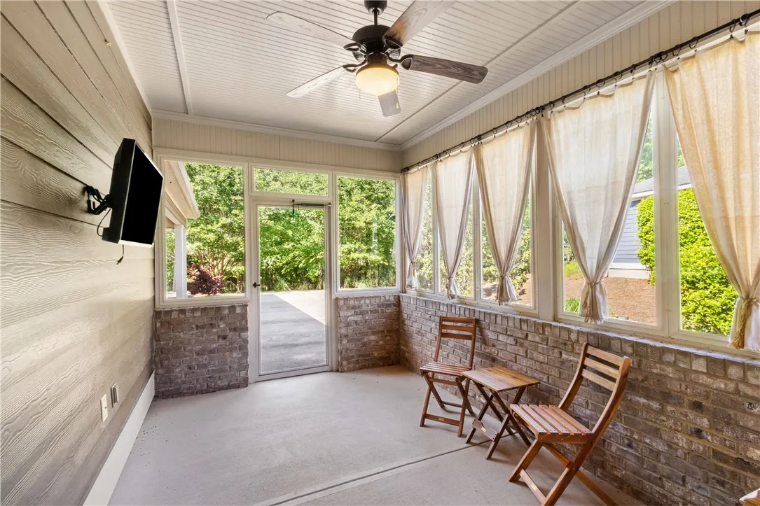 A tranquil screened porch offers an inviting outdoor living space.