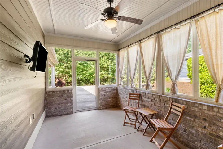 A tranquil screened porch offers an inviting outdoor living space.