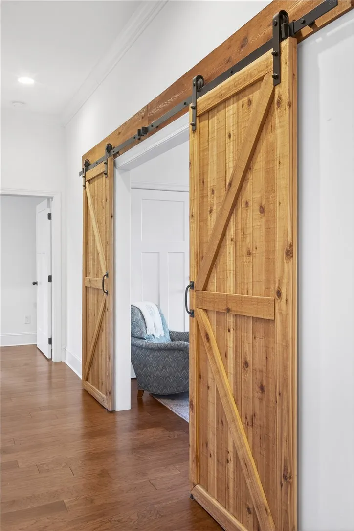 These rustic wood barn doors reveal a spacious Study/Office.
