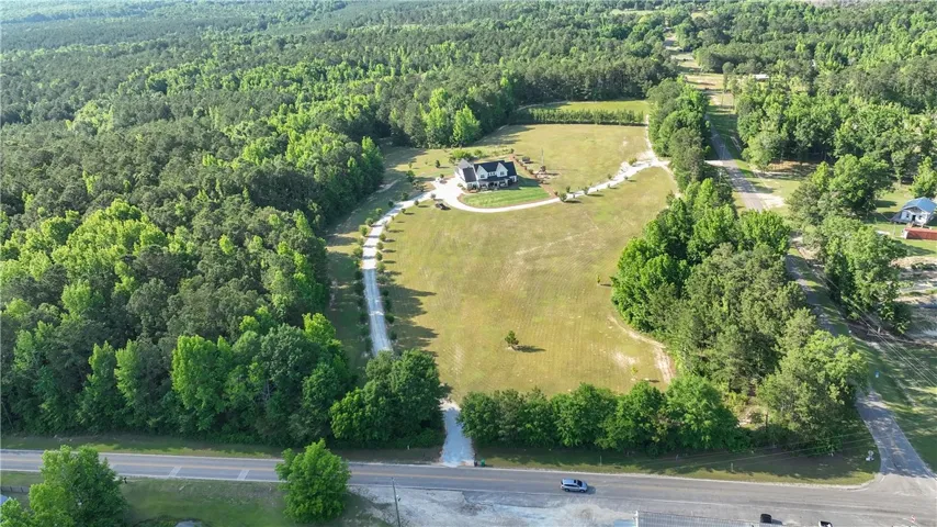 Nestled among vast greenery, this property offers a peaceful, private retreat with expansive natural surroundings.