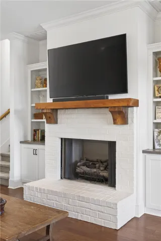 A whitewashed brick hearth provides a cozy focal point in this inviting living area.