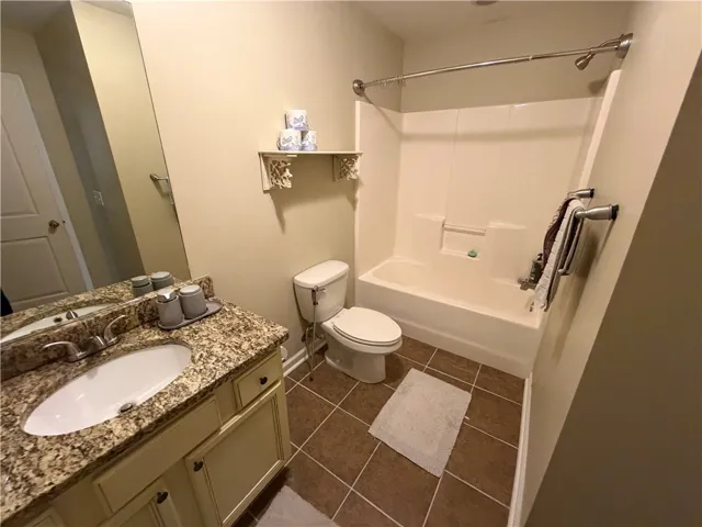 A well-appointed bathroom with a spacious vanity and combination shower-tub.
