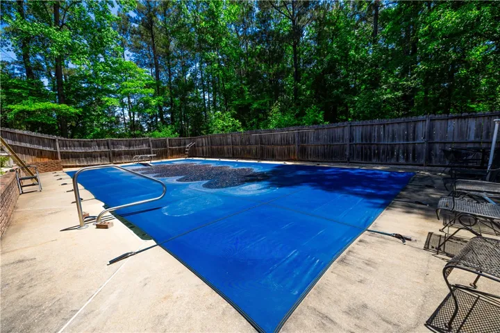 A private backyard oasis with an inviting pool, perfect for outdoor relaxation and entertaining.