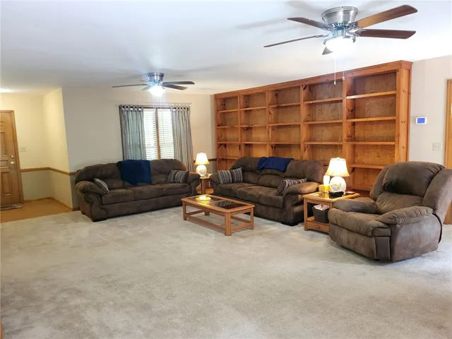 Custom built-in shelving adds character to this inviting living area.