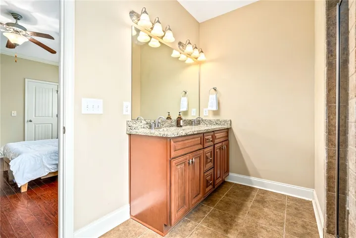 Double vanity and a spacious mirror create a functional bathroom oasis.