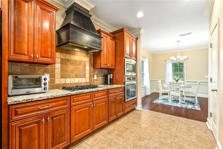 Culinary delights await in this well-appointed kitchen, flowing into an inviting dining space.