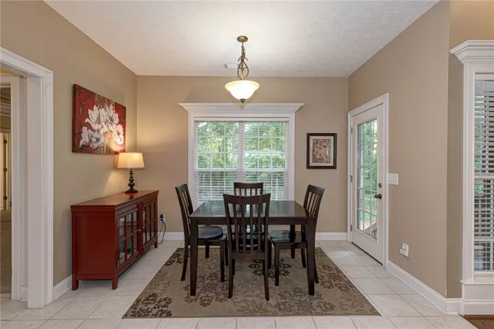 A tranquil dining space with natural light and easy outdoor access.