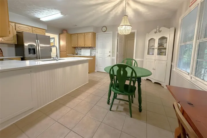 A well-equipped kitchen provides abundant counter space and a convenient breakfast bar for casual dining.