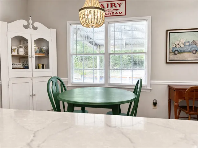 A quaint breakfast nook offers a charming dining experience with ample natural light.