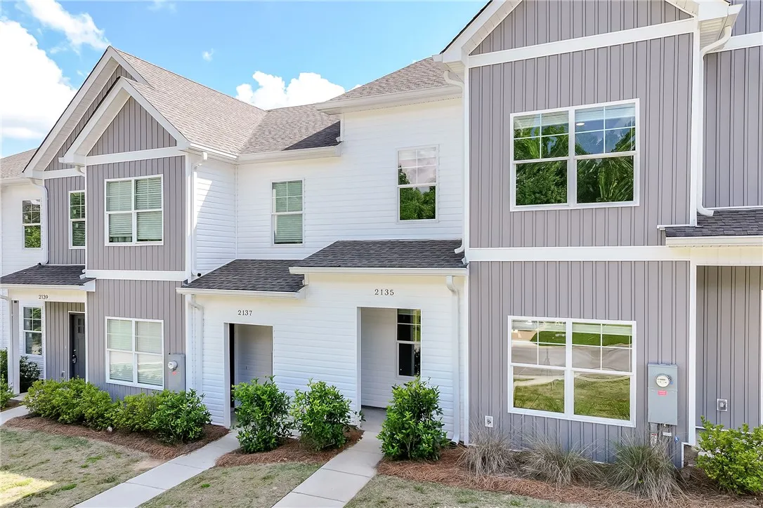 Clean lines and modern siding define the appealing curb appeal of these townhomes.