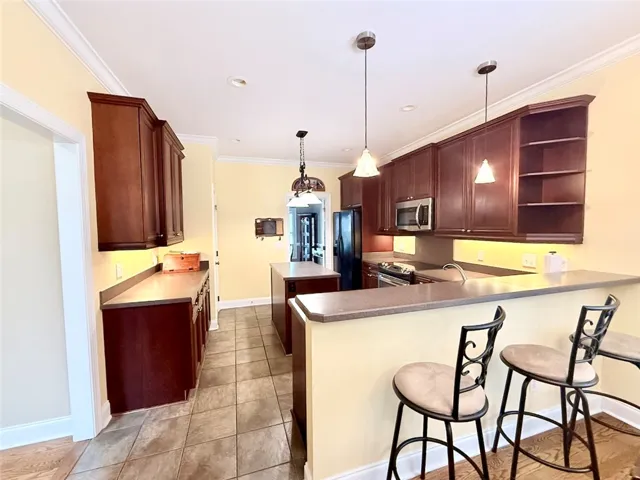 A functional kitchen, equipped with modern appliances and ample counter space for daily culinary tasks.