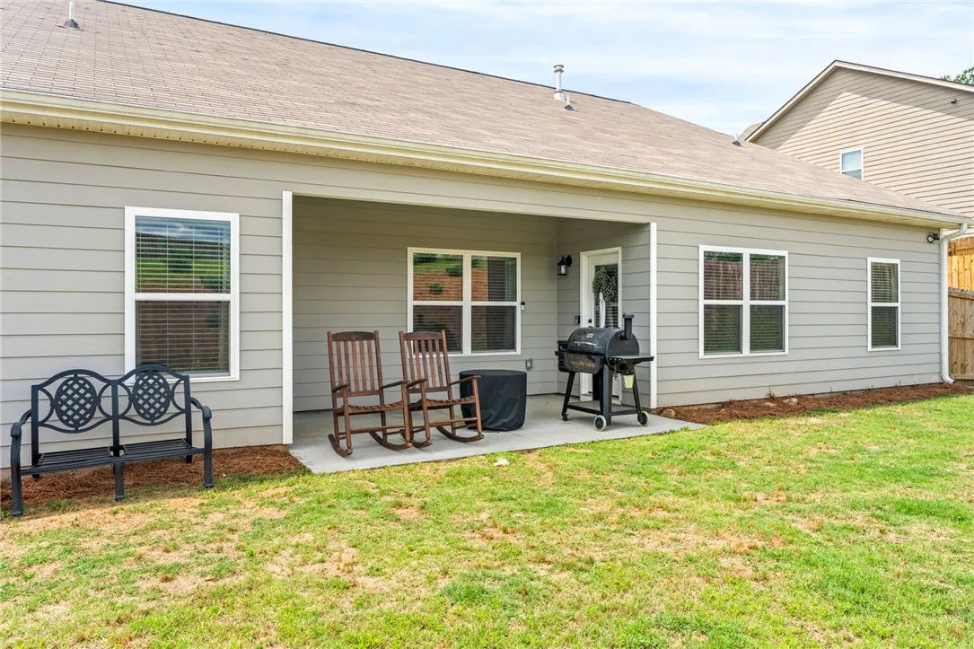 A private rear patio offers space for outdoor living and casual entertaining.