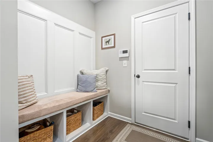 Built-in storage bench creates a welcoming and organized entryway.