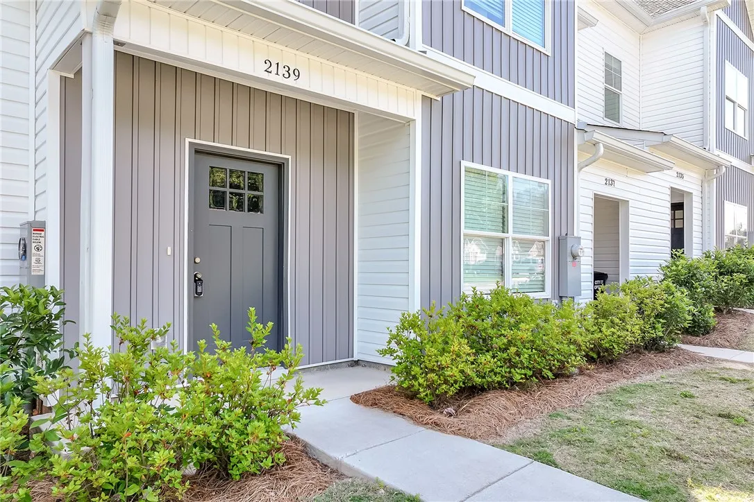 A welcoming entry invites you home to this neatly maintained multi-level residence with vibrant landscaping.