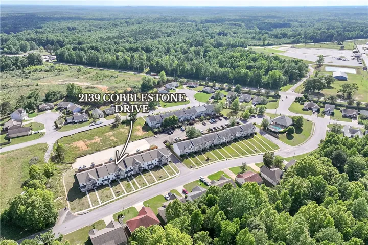 Discover a thriving community, where townhomes and verdant landscapes blend seamlessly.
