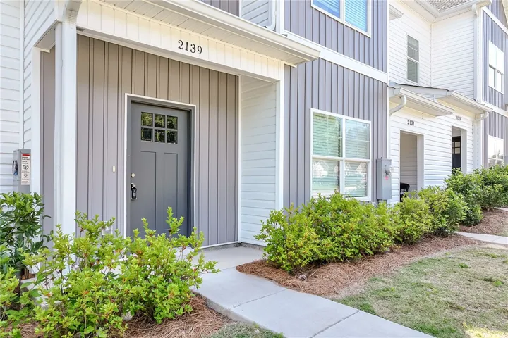 A welcoming entry invites you home to this neatly maintained multi-level residence with vibrant landscaping.