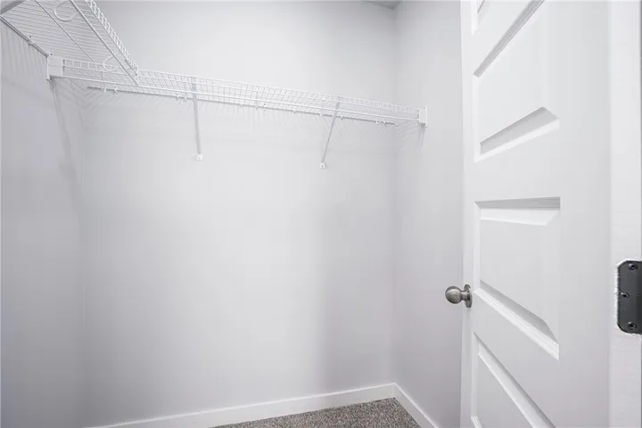 Streamlined storage solutions in a well-lit closet, featuring practical wire shelving.