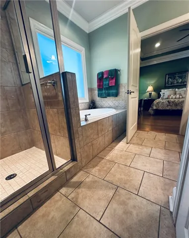 A rejuvenating oasis with a deep soaking tub and a spacious walk-in shower awaits.