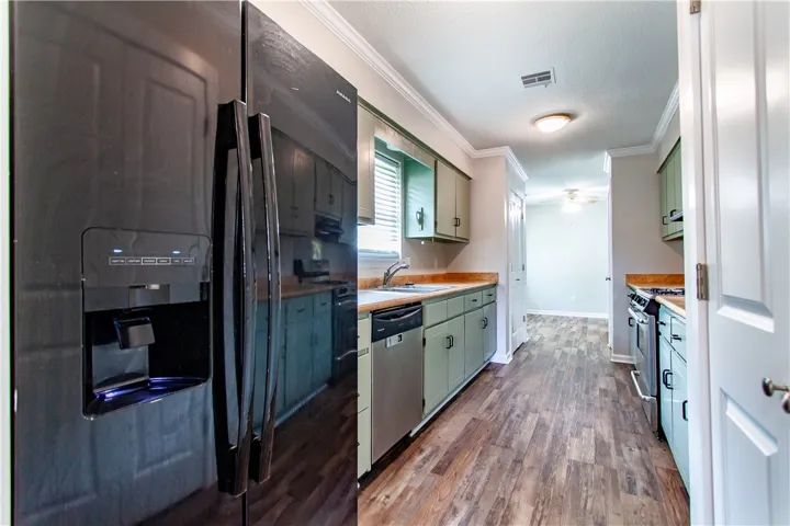 A well-equipped kitchen offers ample cabinetry, stainless steel appliances, and wood-look flooring.