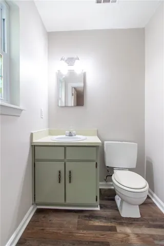 Functional full bathroom featuring a vanity with ample counter space and durable flooring.
