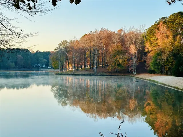 Experience serene lakefront living with vibrant autumn colors