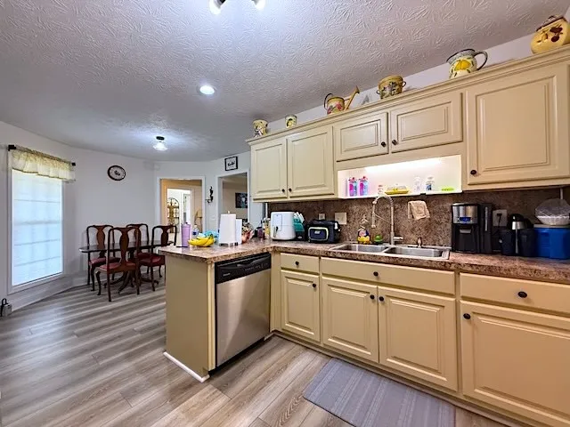 A well-equipped kitchen features ample cabinet space, a practical countertop, and modern appliances.