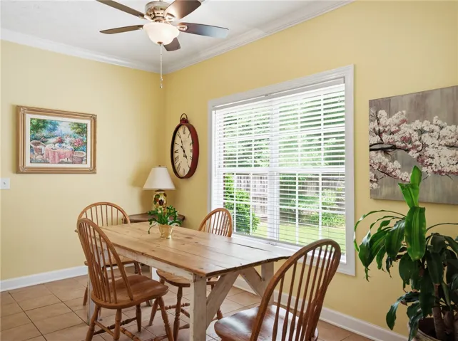 A well-lit dining area offers a casual gathering space with garden views.