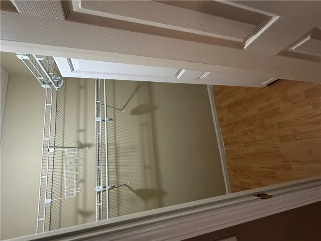 Customizable wire shelving offers organized storage solutions for your wardrobe.