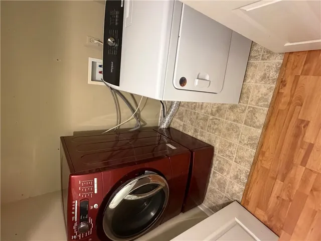 Functional laundry nook with dedicated washer and dryer.