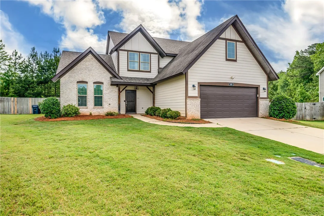 A well-kept front yard offers delightful curb appeal to this charming residence.