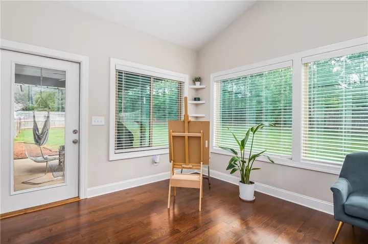 Hardwood floors and natural light illuminate this versatile bonus room.