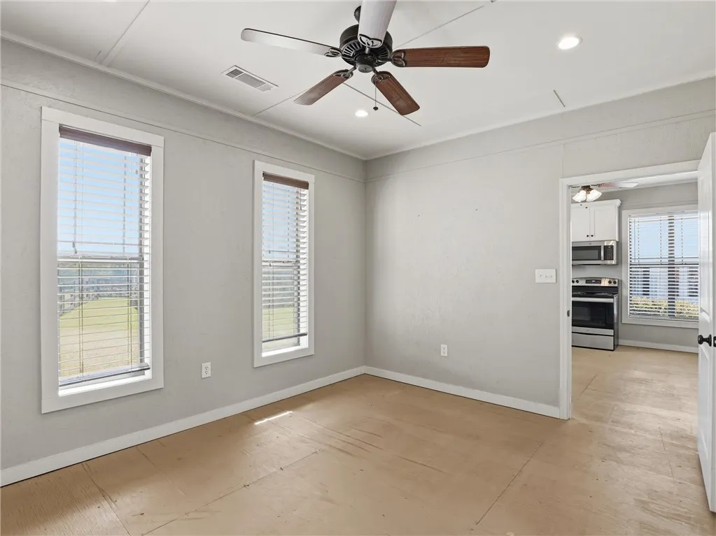 A versatile room bathed in natural light, awaiting your personal touch for ultimate comfort and style.