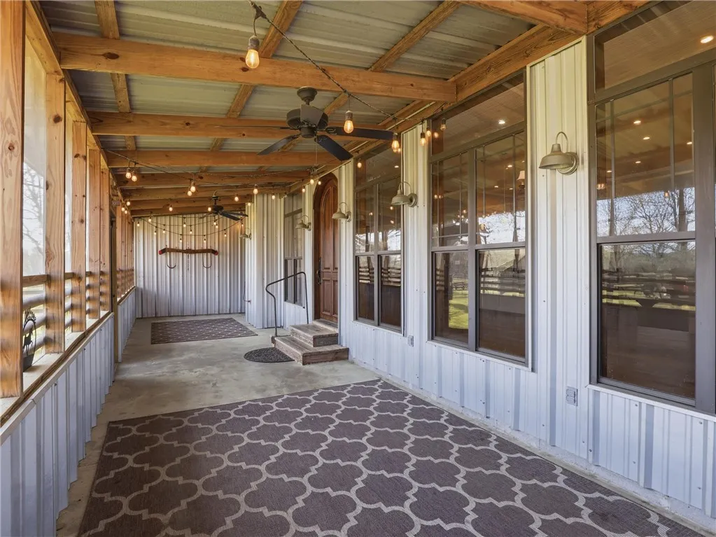 A spacious covered porch invites comfortable outdoor living with ample room for relaxation and entertaining.
