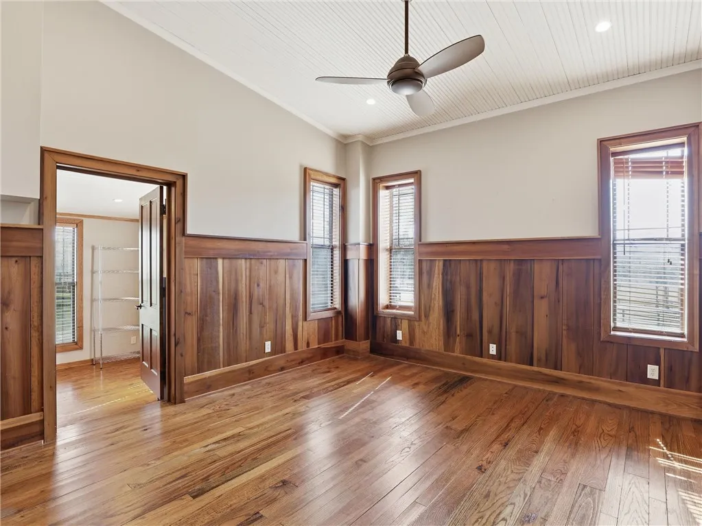 Rich hardwood paneling and flooring create a warm and inviting atmosphere.