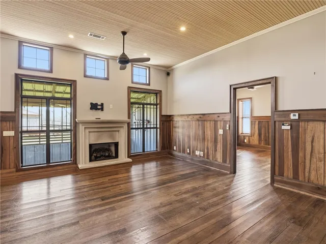 Hardwood floors and a cozy fireplace create a warm and inviting atmosphere.