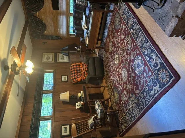 Rich wood paneling and natural light create a warm, inviting living space.