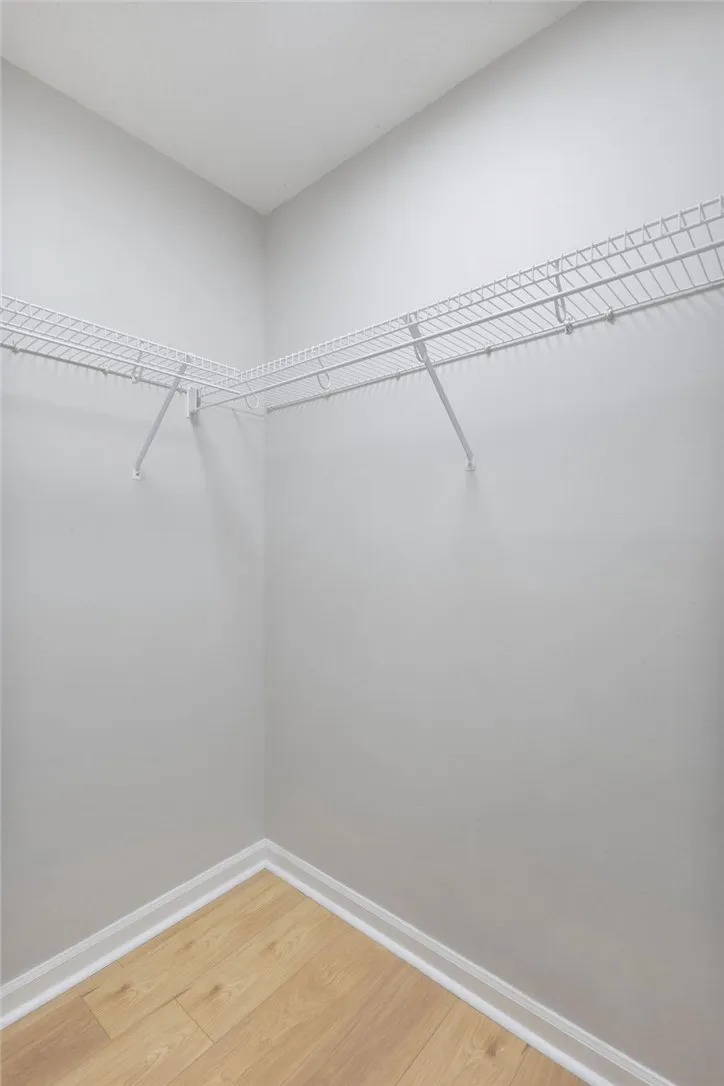 Functional wire shelving provides ample storage in this well-appointed closet.