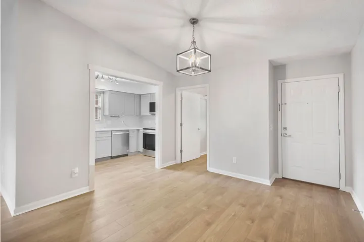 An inviting open-concept layout connects the kitchen and living areas, offering effortless movement throughout the home.