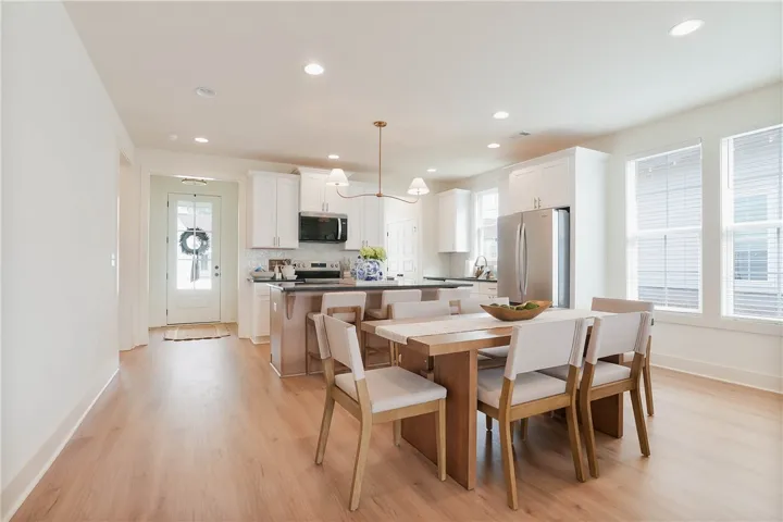 A seamless blend of kitchen and dining creates an inviting atmosphere for everyday living.