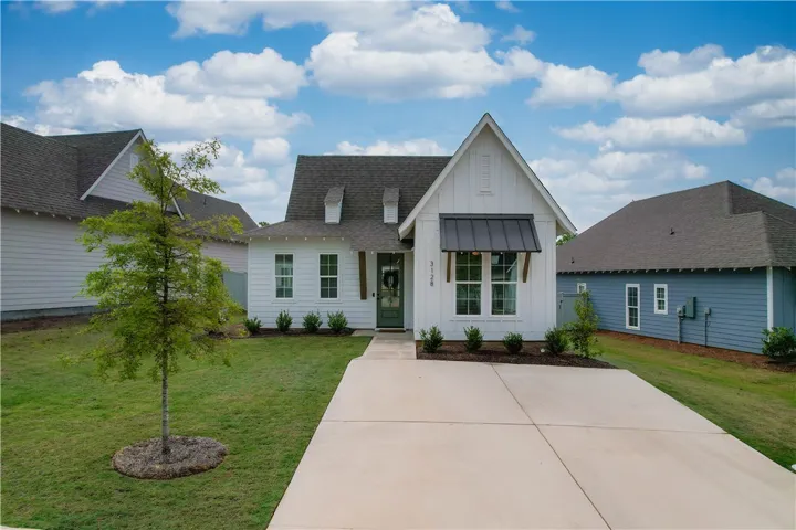 A classic facade with a covered entry welcomes you to this charming single-family home.