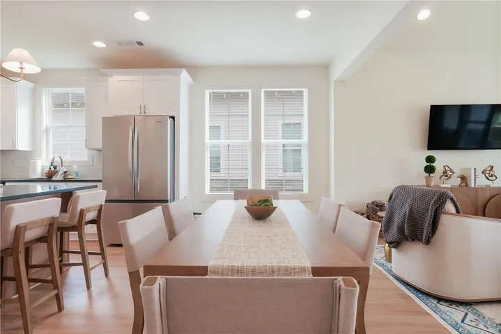 An open floorplan seamlessly connects the kitchen to the dining area and living space.