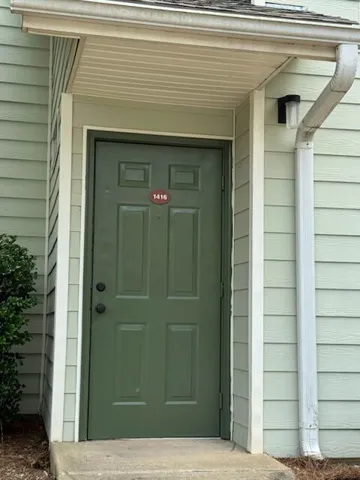 A welcoming entry invites you home, offering convenient access to a comfortable residence.