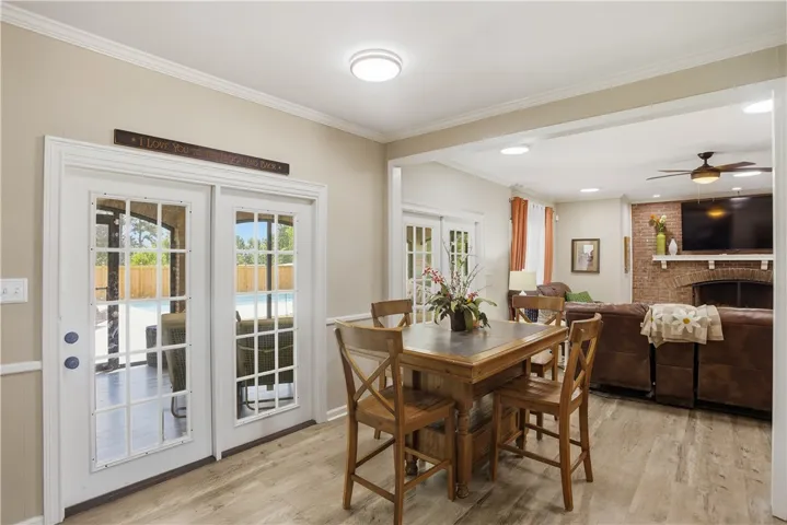 French doors open to an outdoor oasis, inviting seamless indoor-outdoor living.