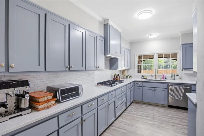 A well-appointed kitchen features ample cabinetry and a practical layout, perfect for everyday living.